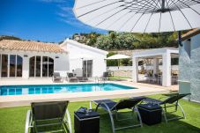 Detached villa in Moraira with private swimming pool and garden with sunbeds