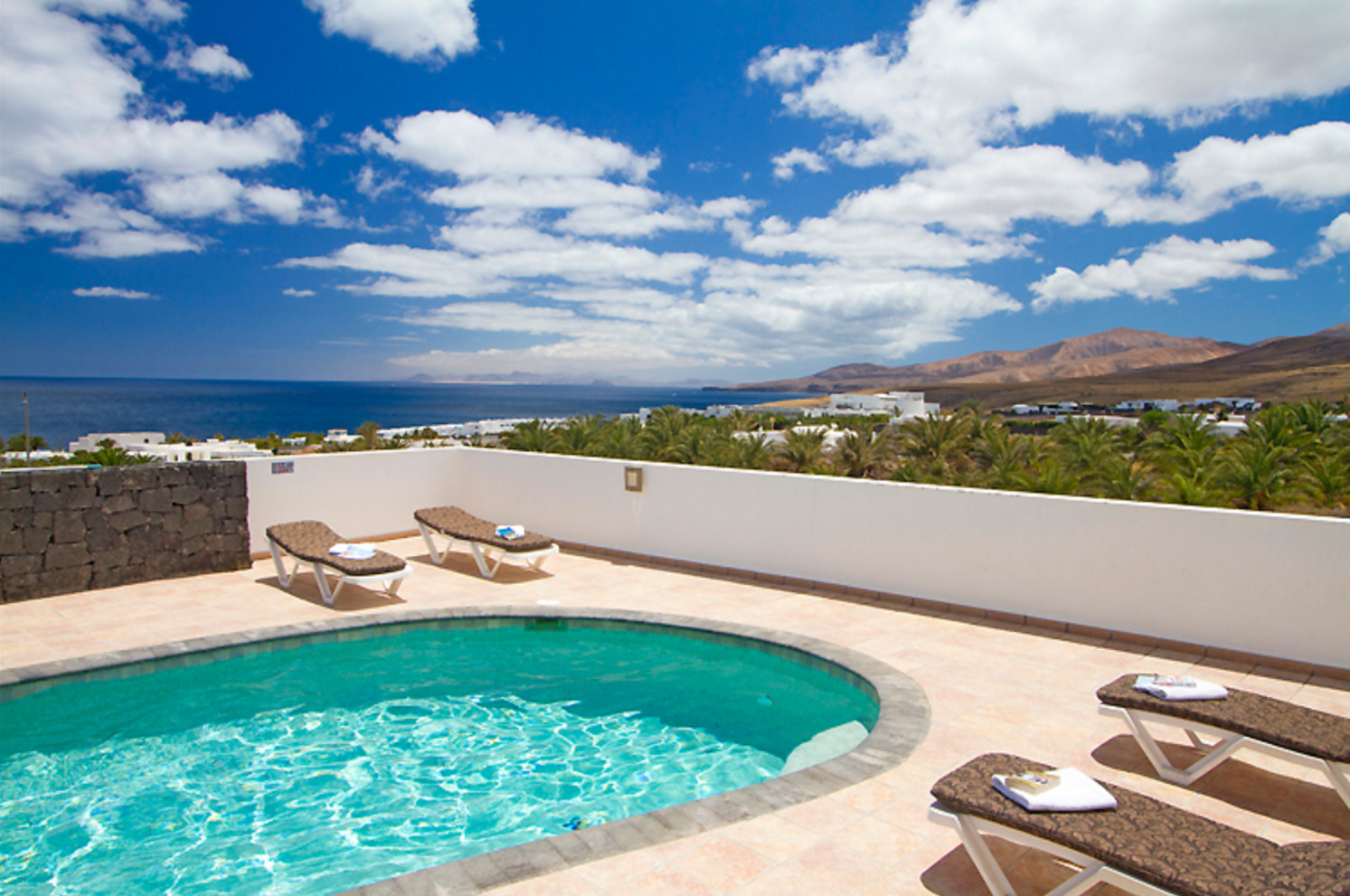 Villa Jane is a luxurious holiday home with heated private pool and panoramic sea view in Puerto Calero, Lanzarote