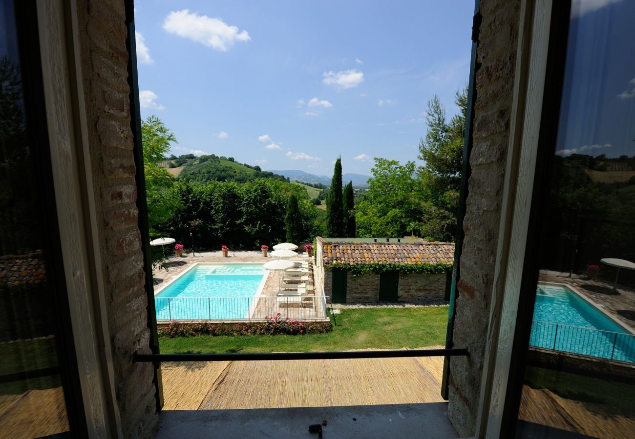 Antico Casolare is an unique villa with private pool and vineyard in Le Marche, Italy. Ideal for large groups!