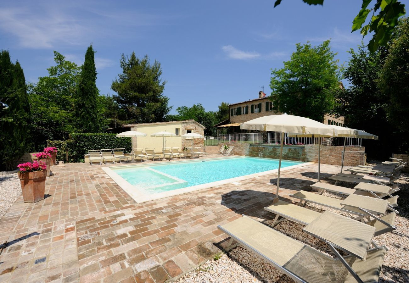 Antico Casolare is an unique villa with private pool and vineyard in Le Marche, Italy. Ideal for large groups!