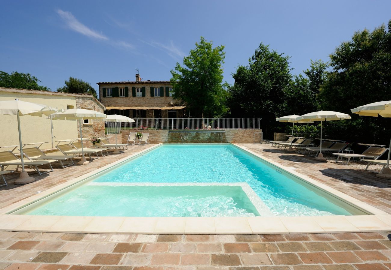 Antico Casolare is an unique villa with private pool and vineyard in Le Marche, Italy. Ideal for large groups!