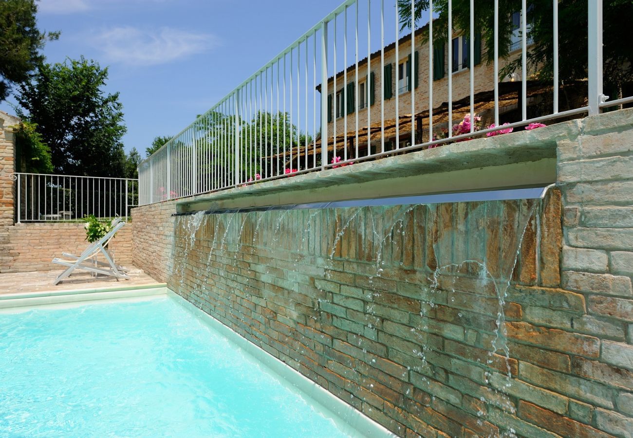 Antico Casolare is an unique villa with private pool and vineyard in Le Marche, Italy. Ideal for large groups!