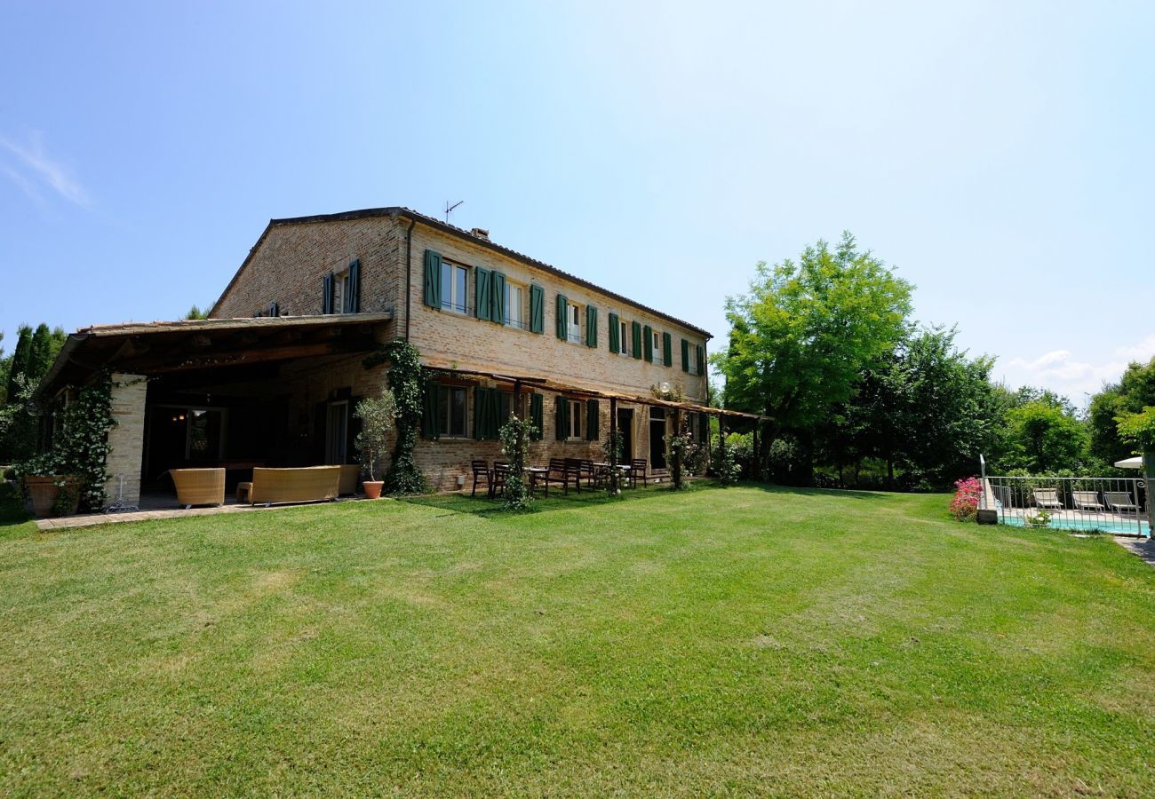 Antico Casolare is an unique villa with private pool and vineyard in Le Marche, Italy. Ideal for large groups!