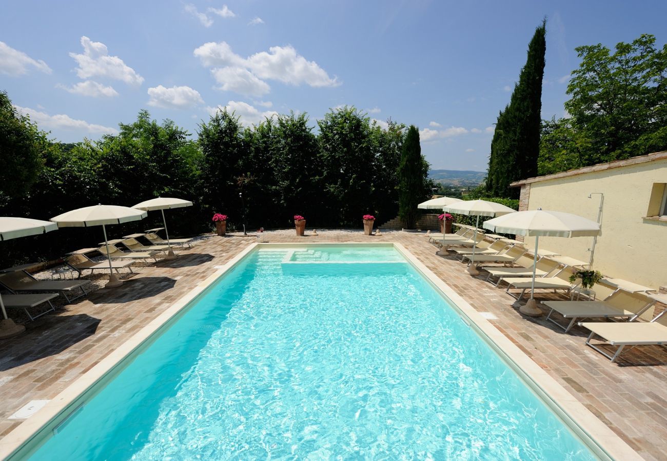 Antico Casolare is an unique villa with private pool and vineyard in Le Marche, Italy. Ideal for large groups!