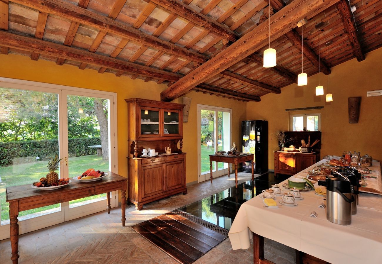 Antico Casolare is an unique villa with private pool and vineyard in Le Marche, Italy. Ideal for large groups!