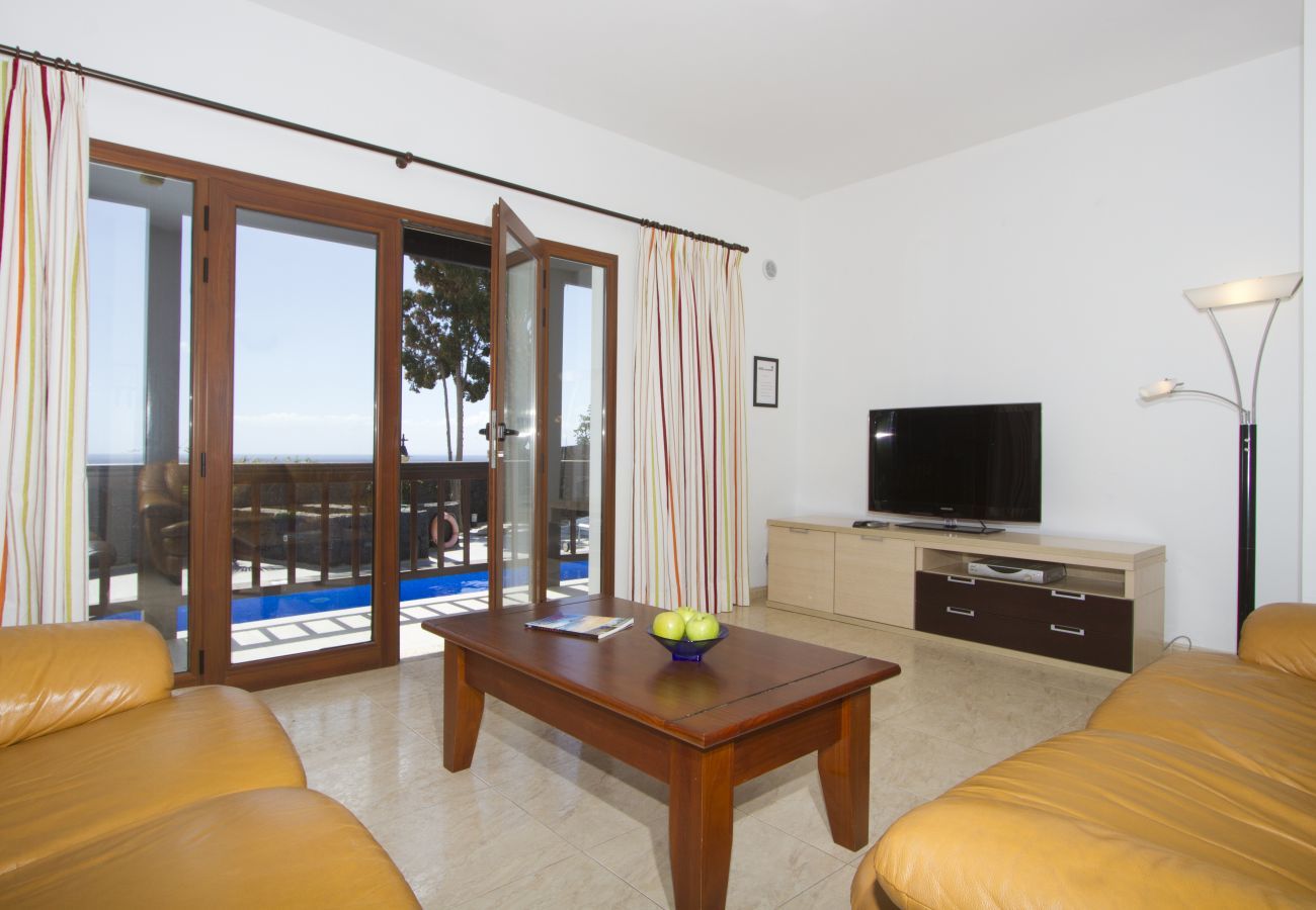 Villa Jill is a modern holiday home with heated private pool and panoramic sea view in Puerto del Carmen, Lanzarote