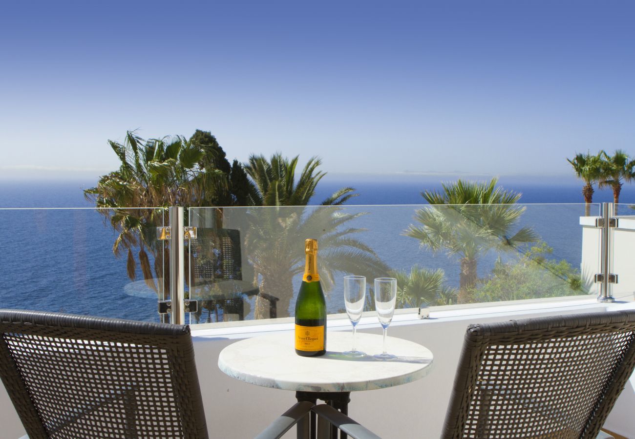 Villa Jill is a modern holiday home with heated private pool and panoramic sea view in Puerto del Carmen, Lanzarote