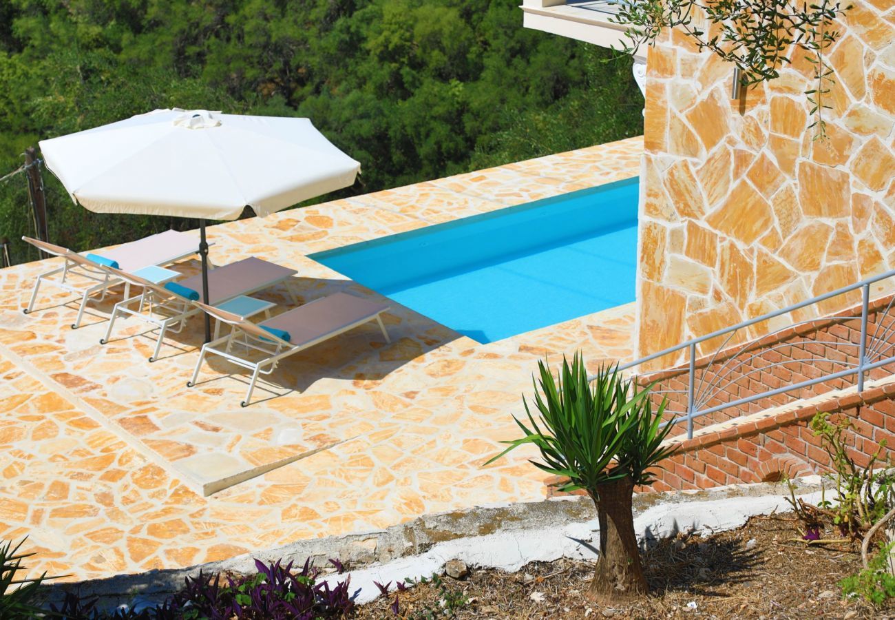 Villa Krouzeri is a detached villa with private pool and panoramic sea view in Agni Bay, Corfu