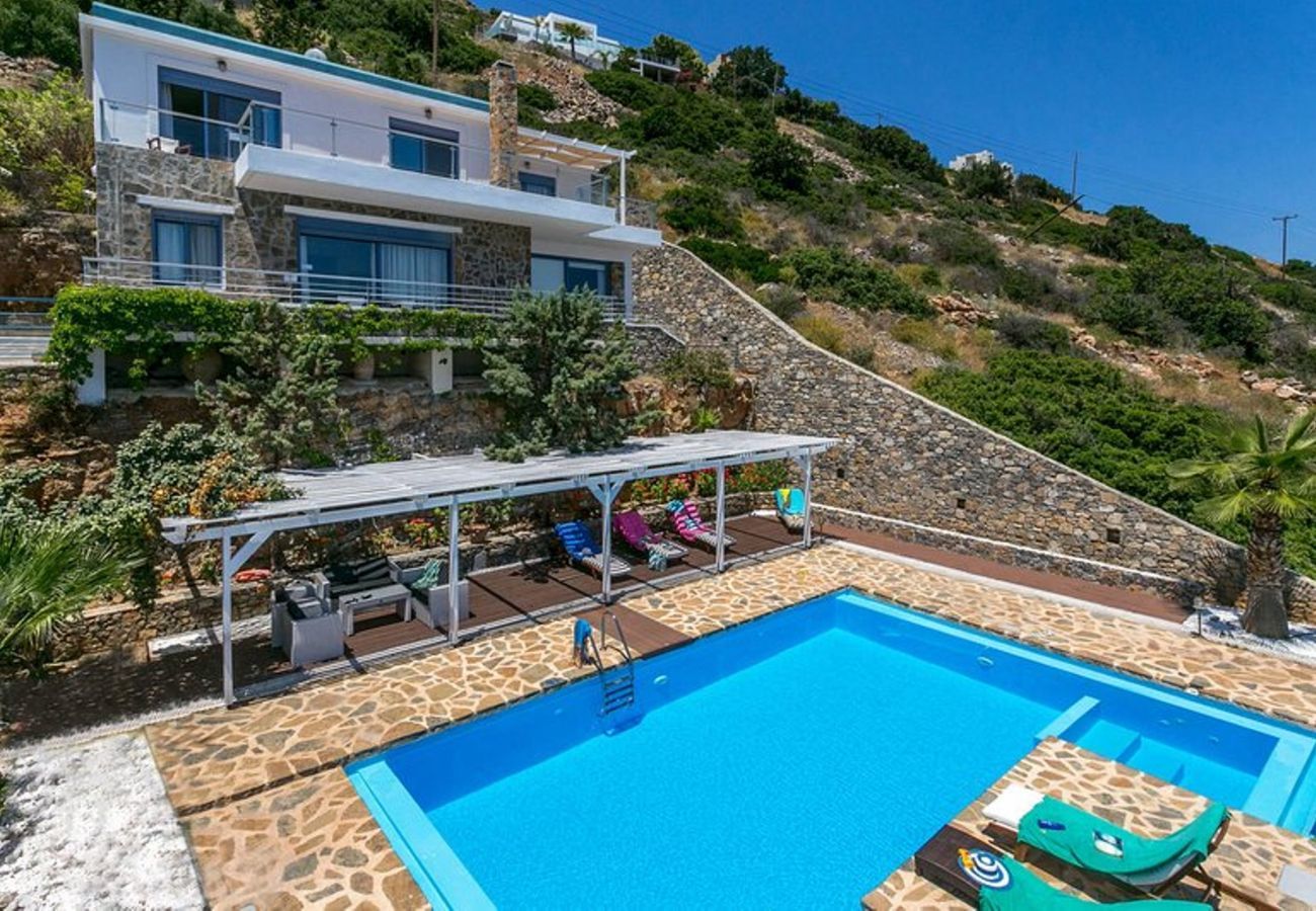 Villa Elounda is a detached villa with private pool and panoramic view over the sea located on a mountain in Elounda, Crete