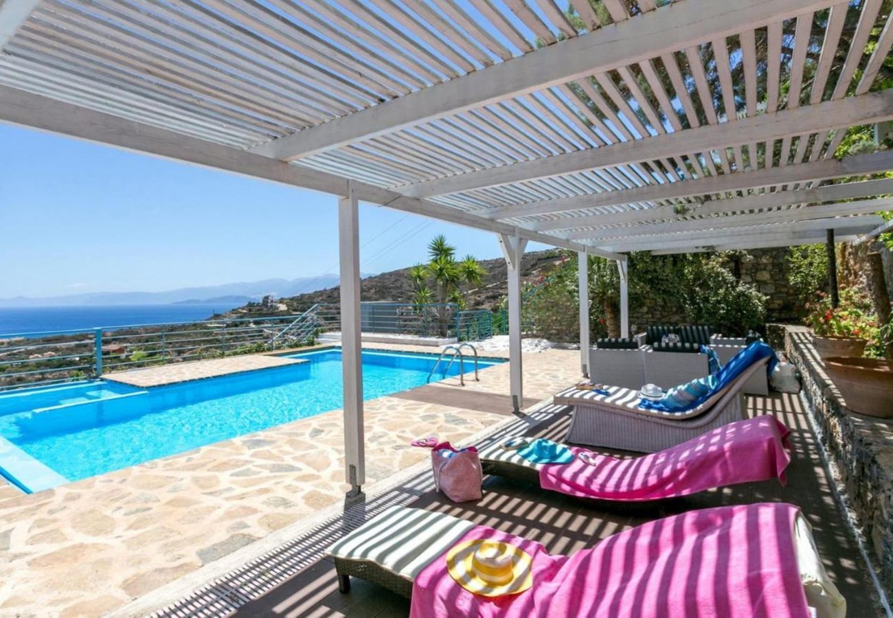 Villa Elounda is a detached villa with private pool and panoramic view over the sea located on a mountain in Elounda, Crete
