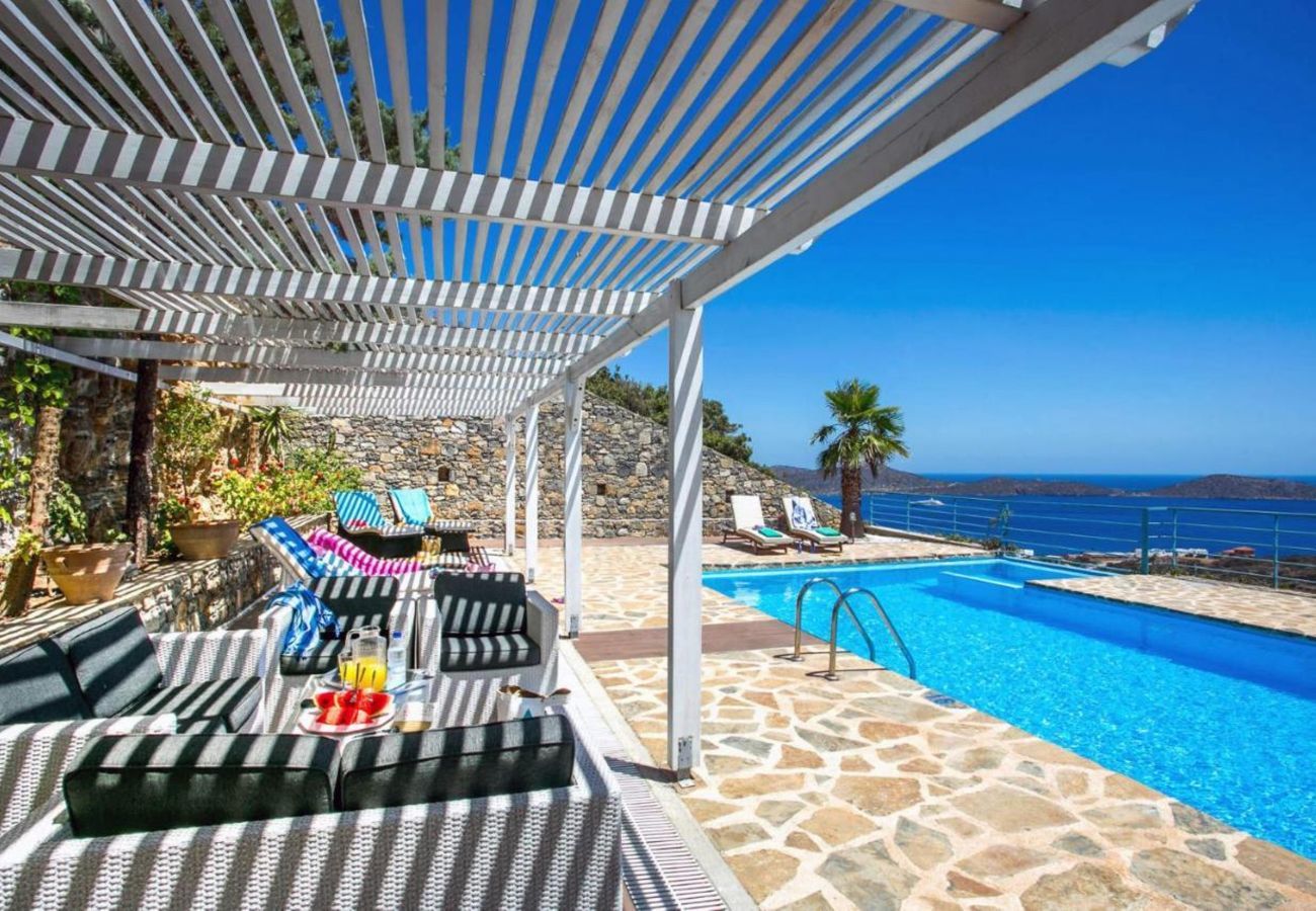 Villa Elounda is a detached villa with private pool and panoramic view over the sea located on a mountain in Elounda, Crete