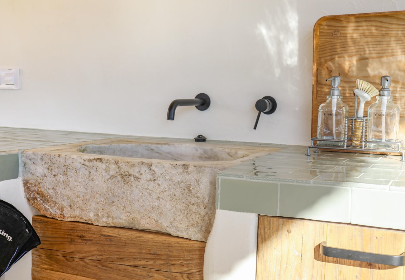 Covered outside kitchen Covered outdoor kitchen with crane