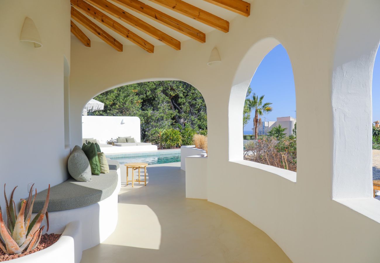 Covered terrace with lounge area Covered terrace with comfortable lounge area and pool view