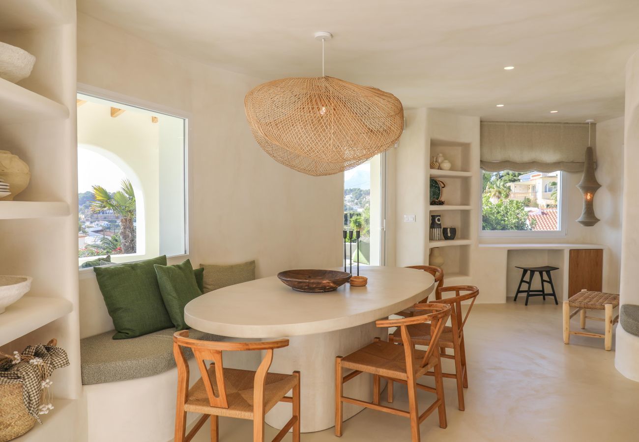 Dining table next to open kitchen Cozy dining table next to open kitchen