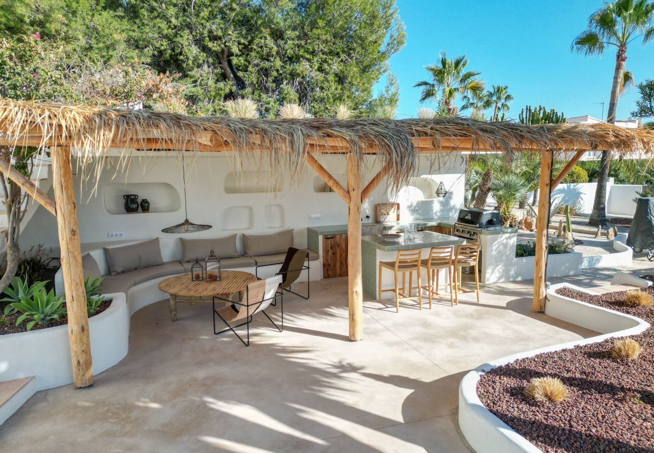 Covered terrace  Covered terrace with seating area and outdoor kitchen