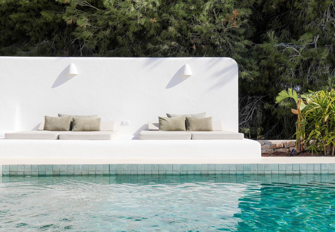 Lounging platform at the private pool Lounging platform with comfortable cushions by the saltwater private pool