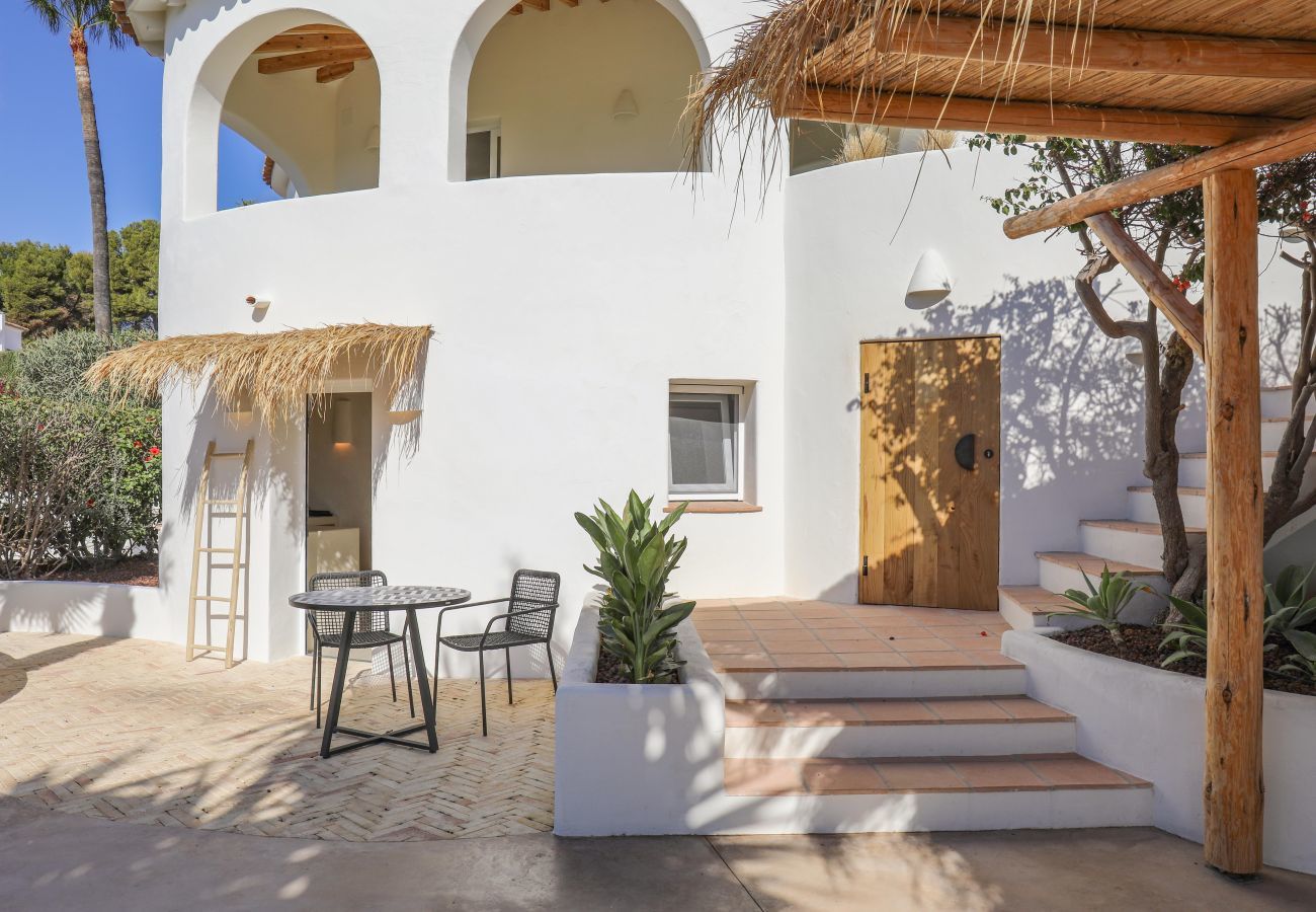 Terrace with balcony above  Terrace with balcony above and seating