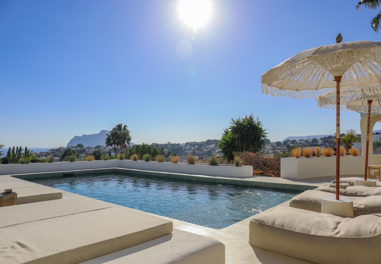 Sun terrace around the private pool Sun terrace with sun beds around the private saltwater pool